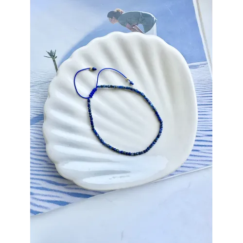 bransoletka-kamienie-naturalne-na-sznurku-lapis-lazuli-kostka